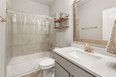 View of one of the bathrooms, very bright and open