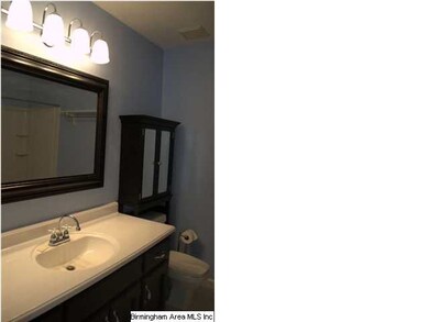 Updated hall bath with marble counter tops and new