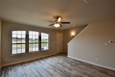 Spare room with ceiling fan and dark hardwood / wood-style flooring