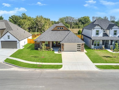 View of front of house with stone siding, covered 