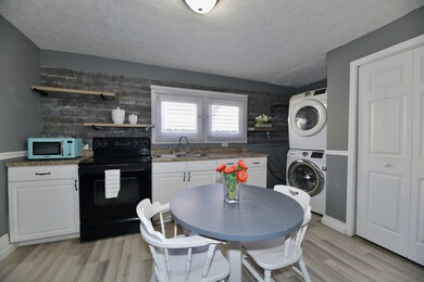Eat-in Kitchen with open shelving.