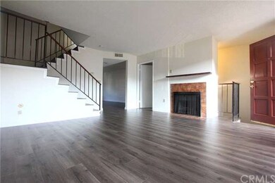 Spacious Living Room with Cozy Fireplace