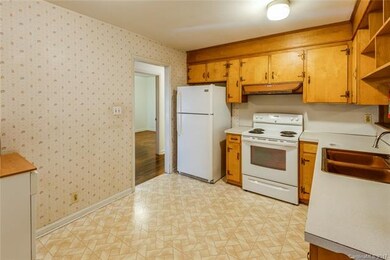Kitchen refrigerator and range are under 2 years o