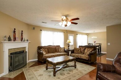 Beautiful granite surround on the fireplace.  Open floor plan with the kitchen as the heart of the home!