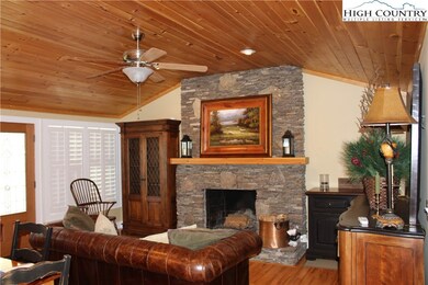 The interior has a wood burning stone fireplace an