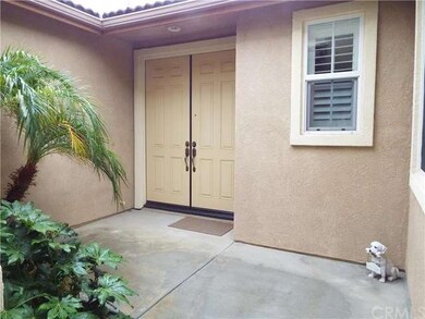Front courtyard and double door entry.