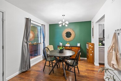 Dining room featuring a notable chandelier, baseb