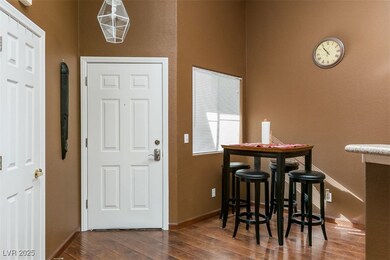Entryway featuring wood finished floors and basebo