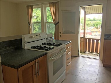 Kitchen opens to back deck and yard