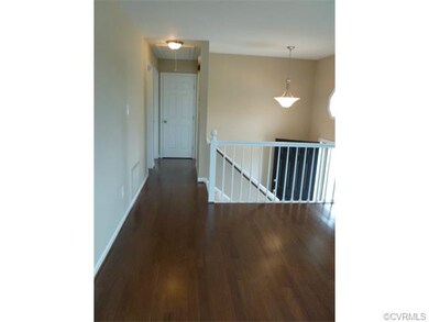 View from Living Room down hallway - New pull down attic steps- full bath to the left, master bedroom to the left, Bedroom #2 to right - Coat closet at end of hallway