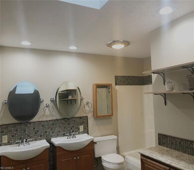 Master bath with his and her vanities