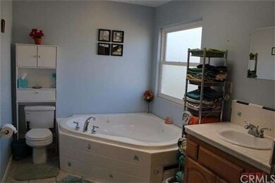 Full guest bathroom with built in Jacuzzi tub, dua