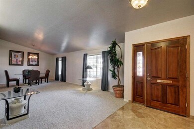 wide wooden door travertine entry