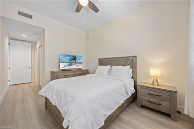 Bedroom featuring light wood-type flooring, a clos