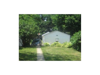 Exterior Back. Garage off back alley with an extra