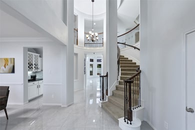 Welcome to a beautiful balanced entryway where mod