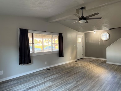 Foyer entrance featuring wood finished floors and ceiling fan