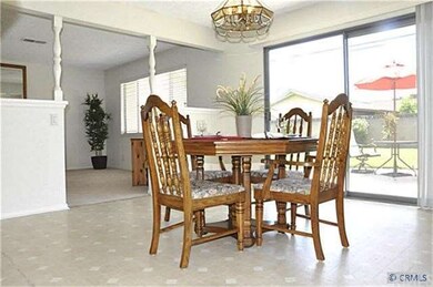 Separate Dining Room Looks Out to Landscaped Back 