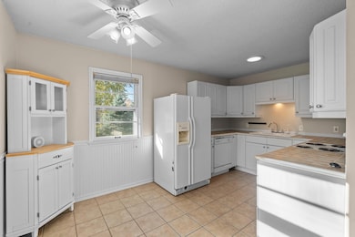 This bright white kitchen awaits your cooking adventures