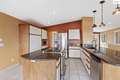 Kitchen with Island and Stainless Steel Appliances