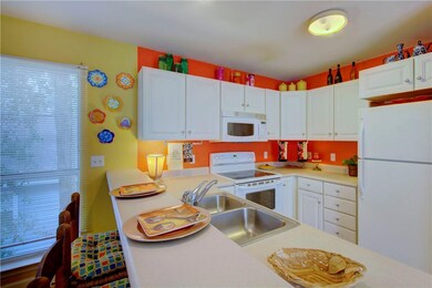 Nice, bright kitchen with plenty of cabinets & wor