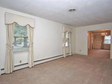 Large formal living room that opens to the dining room.