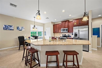 Open floor plan with spacious kitchen featuring st