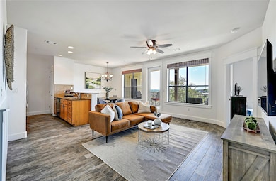 Living room with baseboards, visible vents, ceili