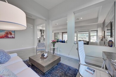 Living area with baseboards and recessed lighting