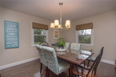 Rich hard wood floors and neutral paint tones in t