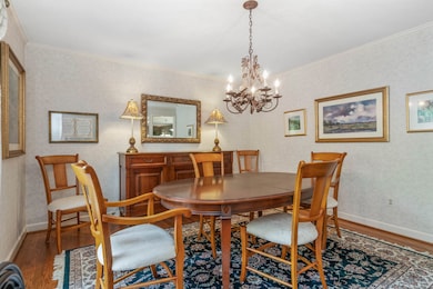 The formal dining room offers space for entertaining and flows into the kitchen.