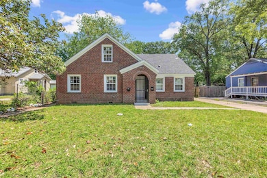 View of front of property with fence, a front yard