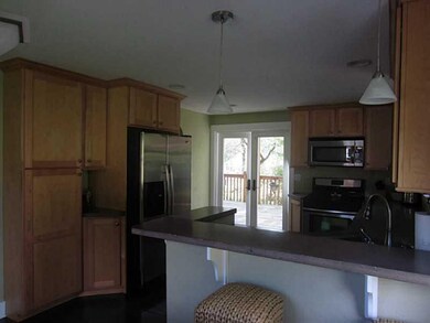 Kitchen. Great counter tops and modern!  Patio doo