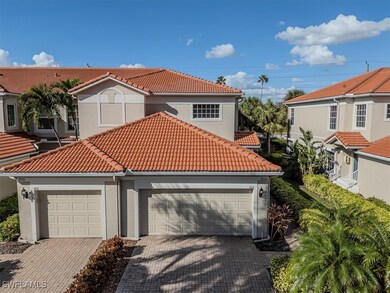 Mediterranean / spanish-style home featuring a gar