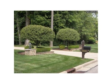 Entry drive w/ pristine landscaping.