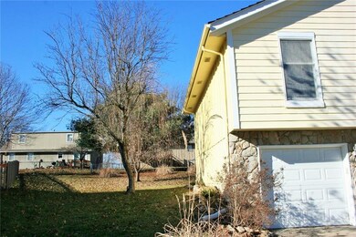 South side of the house, partial fencing along the