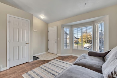 Entrance foyer featuring wood finished floors