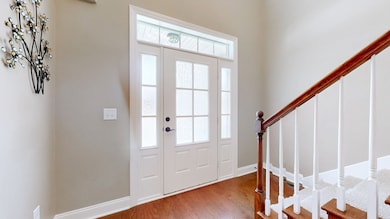 Gorgeous front foyer with vaulted ceilings.