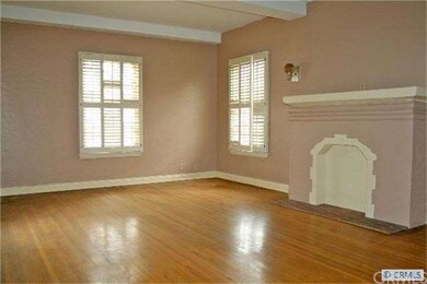 Living room has wood window panes, oak floors, moc
