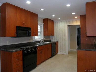 Mahogany Cabinets,Ceramic Tile Floor,Black Applian