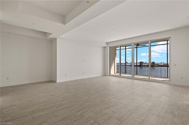Open concept living room offering abundant light and serene coastal ambiance.