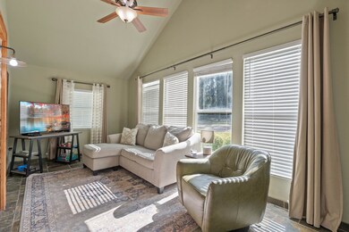 Alternate angle of the living room highlighting the open feel and smooth flow into the adjoining spaces.