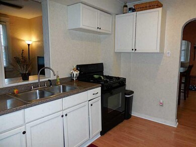 Kitchen. The family room through the pass through 