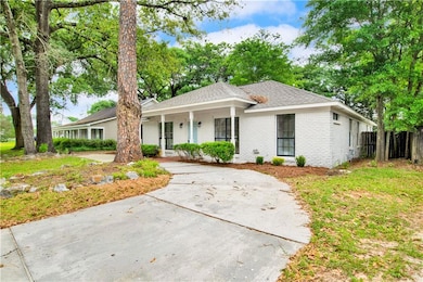Single story home with fence, covered porch, roof 