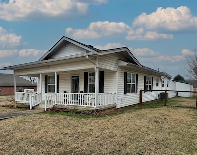 View of front facade with covered porch and centra