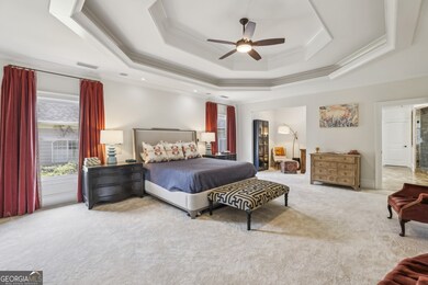 Upstairs, the Oversized Primary Suite offers a Serene Escape with Room for a Sitting Area, a Built-In Wet Bar for your morning coffee, and Two Massive Walk-In Closets