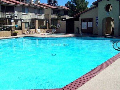 Property Photo. Large swimming pool behind this to