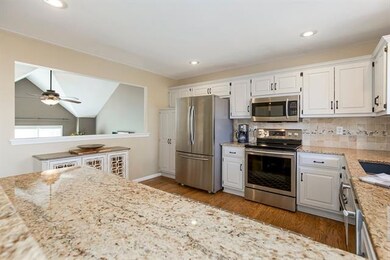 A modern kitchen with new oven, painted cabinets a