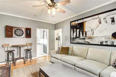 Alternative view of living room.  Space for bistro table for dining or hanging out.  Door to the left leads to kitchen and door to the right leads to bedrooms.