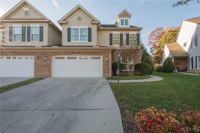 View of front of property featuring a garage and a